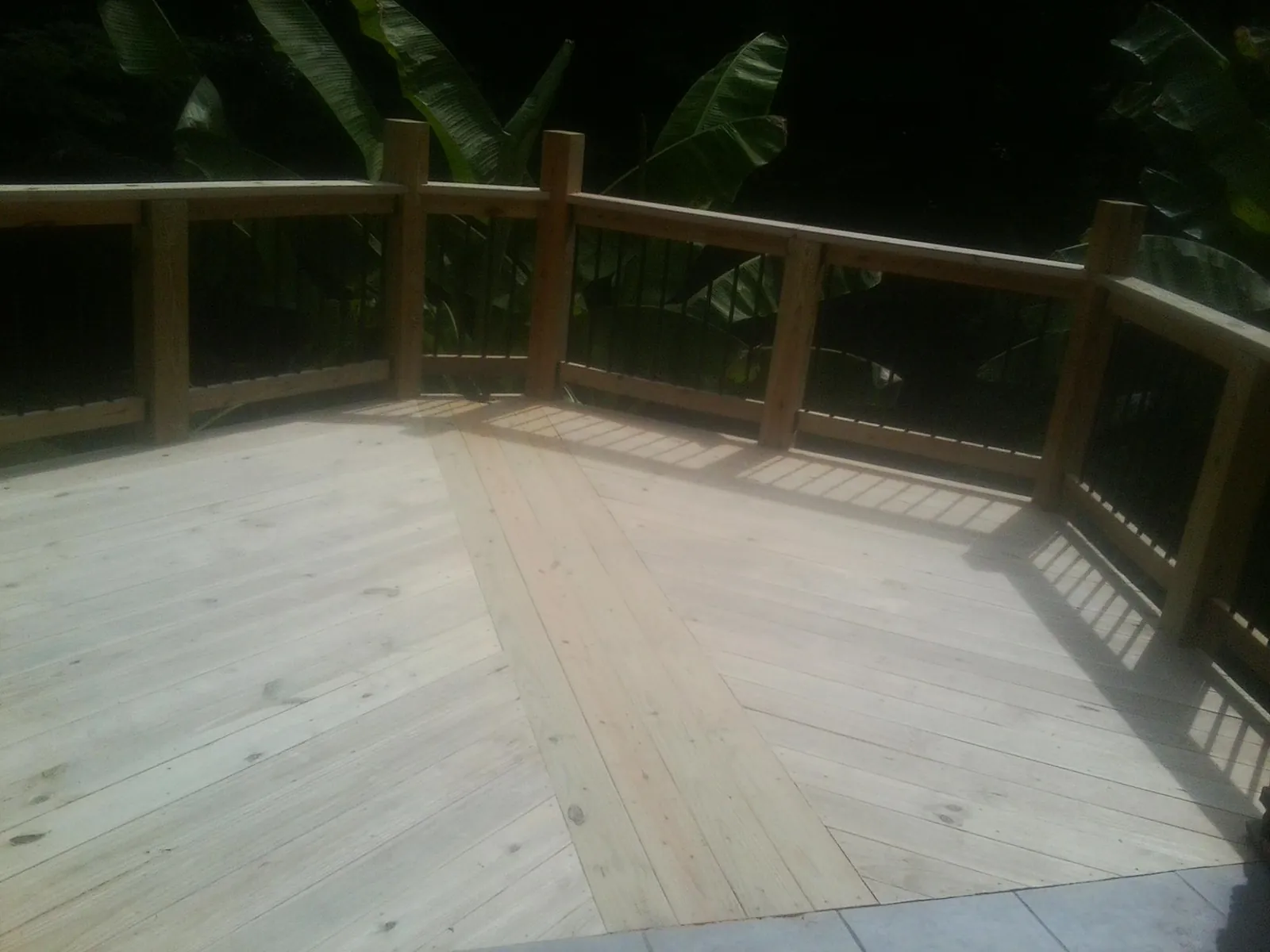 New wood deck and railing built off the back of a home in Grand Junction